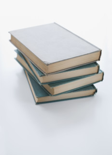 Close up of stack of books.