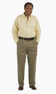 Studio shot of man with hands in pockets.