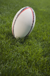 Close up of football on grass.