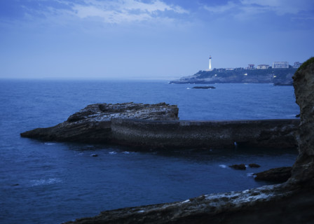 Scenic view of cliffs and lighthouse, Biarritz, France.