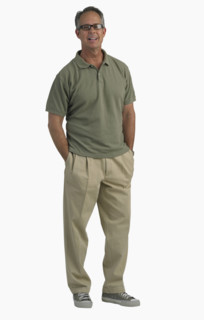 Studio shot of man with hands in pockets.