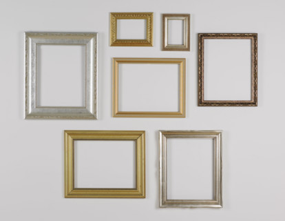 Still life of hanging picture frames without pictures.