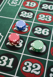 Closeup of wagers on gaming table.