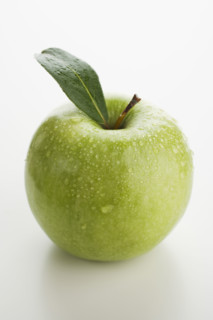 Close up of apple with water droplets.