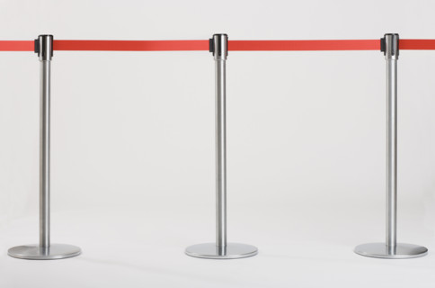 Studio shot of retractable belt crowd control barriers.