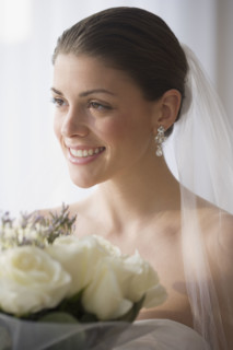 Portrait of bride holding bouquet.