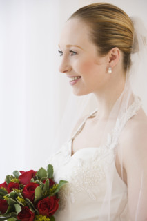 Close up of bride holding bouquet.
