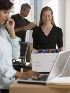 Businesspeople working in new office.