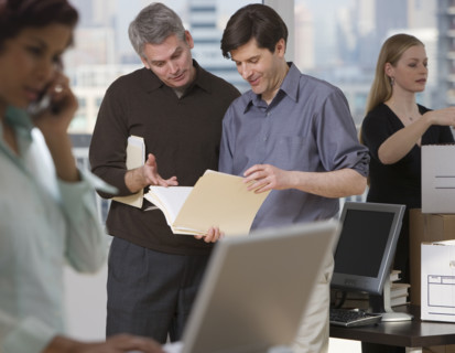 Businesspeople working in new office.