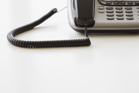 Close up of corded telephone.