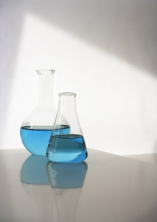 Two beakers with liquid.