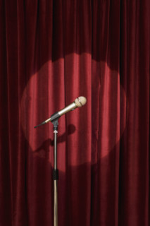 Spotlight on microphone on stage.