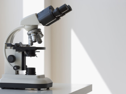 Microscope on table.