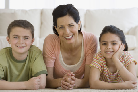 Portrait of mother and children.