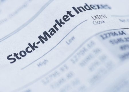 Close up of newspaper financial section.