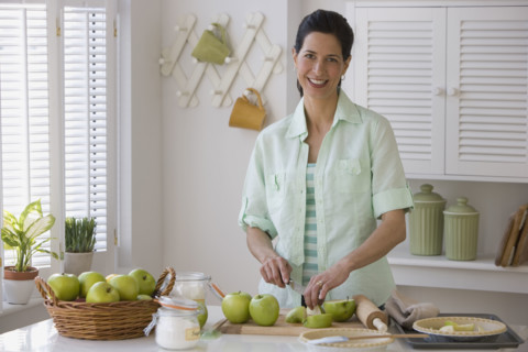 Woman making apple pie.