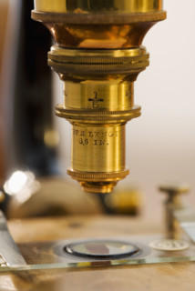Close up of old fashioned microscope.