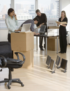 Businesspeople working in new office.