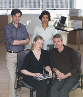 Group of businesspeople in new office.