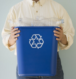 Man holding recycling bin.