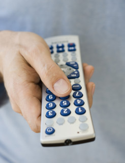 Man holding remote control.