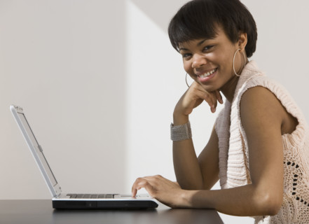 African woman with laptop.