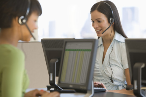 Businesswoman wearing headset.