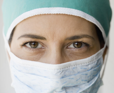 Close up of female doctor wearing surgical mask.