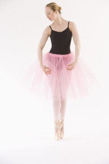 Female ballet dancer dancing on pointe.