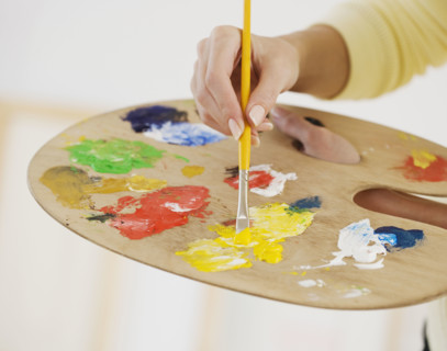 Close up of female artist using palette.