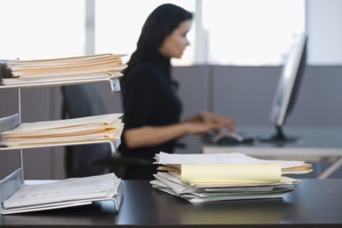 Businesswoman typing on computer.