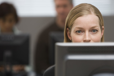 Businesswoman looking at computer.