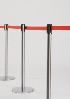 Studio shot of retractable belt crowd control barriers.