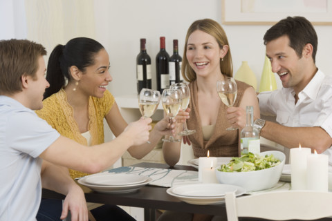 Two couple toasting with wine.