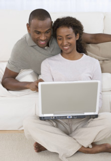 Couple looking at laptop.
