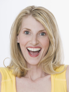 Close up of woman laughing.