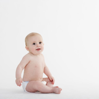 Studio shot of baby in diaper.