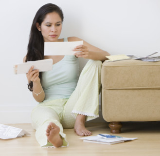 Woman paying bills.