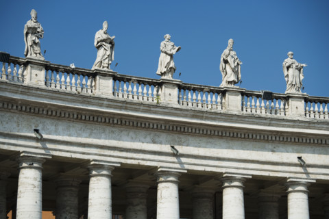 Statues on colonnade at St. Peter’s Basilica, Italy.