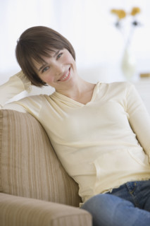 Woman sitting sofa.