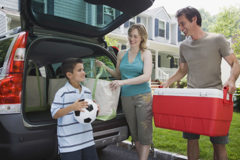 Family loading car for picnic.