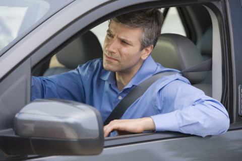 Man driving car.
