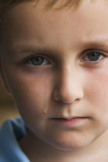 Close up of boy crying.