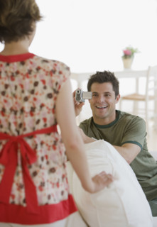 Man video recording girlfriend.