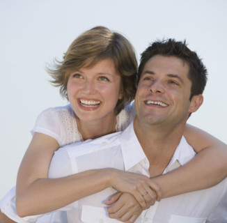 Close up of couple hugging.