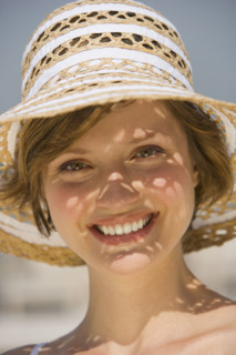 Woman wearing sunhat.