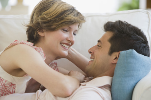 Couple smiling at each other.