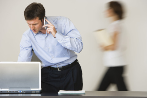 Businessman talking on cell phone.