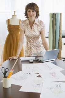 Female clothing designer in shop.