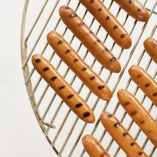 Hot dogs on grill.